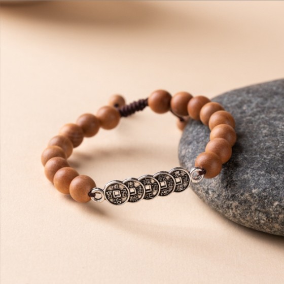 The retro natural silver peach wood Five Emperors copper coin bracelet is an adjustable couple\'s woven bracelet